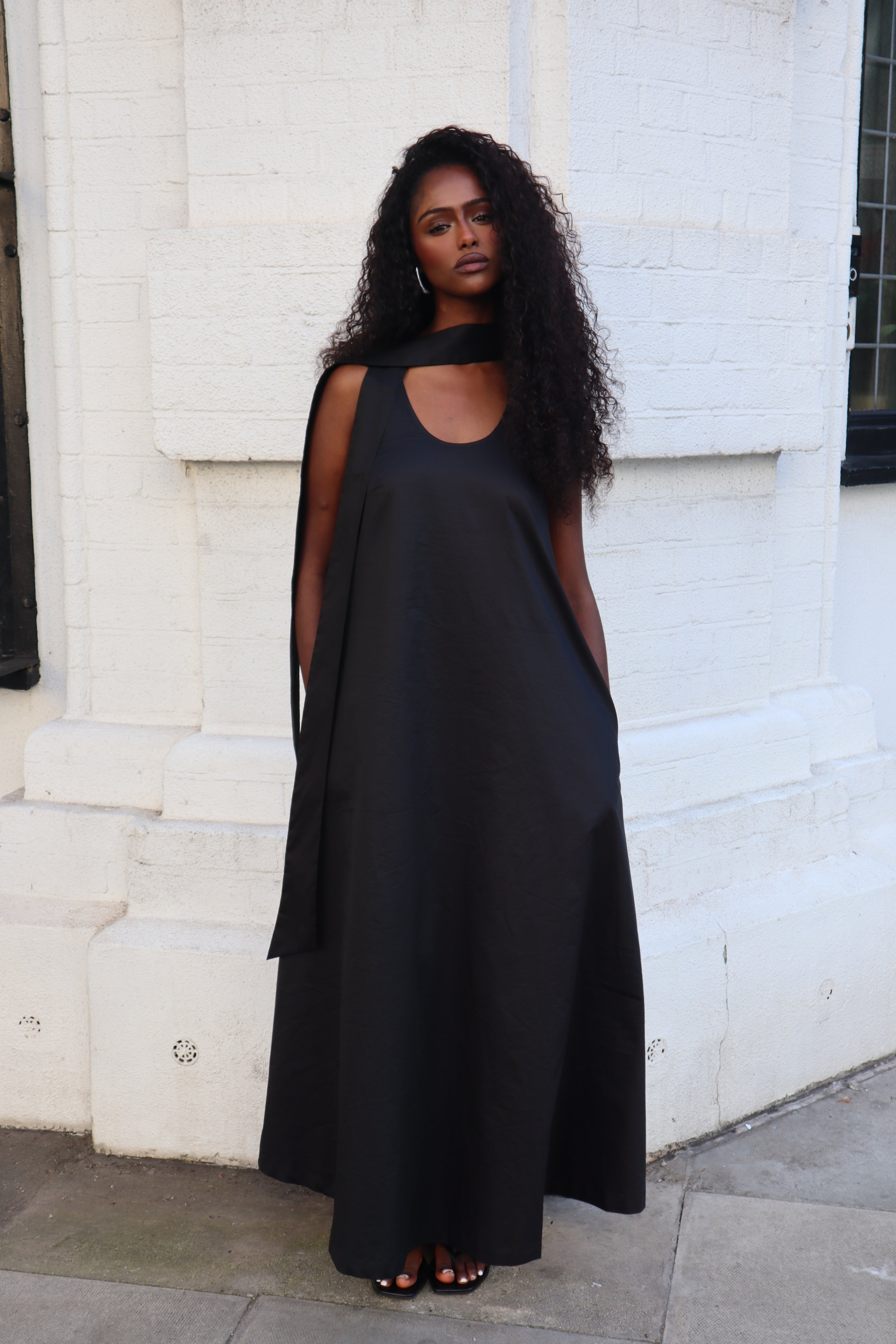 woman wearing elegant cotton draped dress